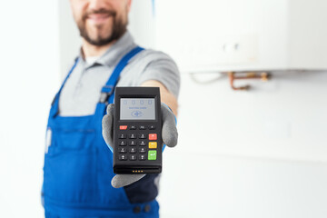 Professional repairman holding a POS terminal