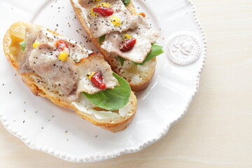 Barbecue pork belly and lettuce on French bread for delicious open sandwich image