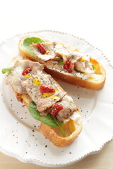 Barbecue pork belly and lettuce on French bread for delicious open sandwich image
