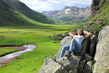 Naklejka premium Woman resting in a mountain landscape