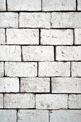 Fototapeta premium White bricks that may be part of the house's walls can be used as a background image in product advertising.