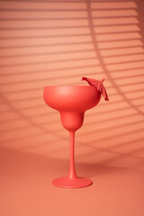 Cocktail glass on a pink background. - Summer concept.
