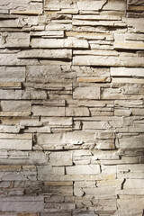Texture stone wall brown mosaic tiles of background.