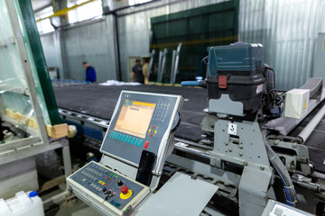 Factory for the production of double-glazed windows made of sheet glass. Sheet glass in pallets near the sheet glass cutting line.