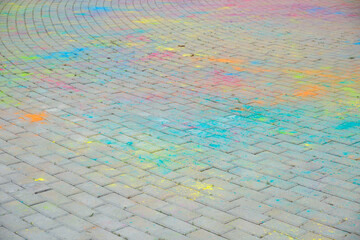 the Indian festival holi, Hindi, the remains of color powder on asphalt