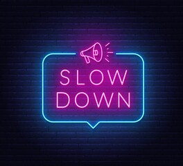 Slow Down neon sign in the speech bubble on brick wall background. - obrazy, fototapety, plakaty