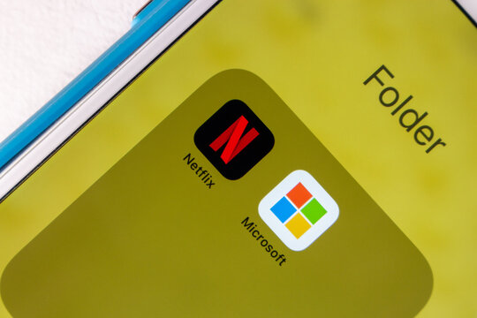 Kumamoto, JAPAN - July 17 2022 : Netflix and Microsoft icons on an iPhone. In July 2022, Netflix announced a partnership with Microsoft for Ad-Supported Subscription
