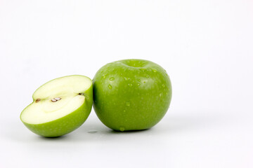 A Green Fresh apple and half slaced isolated on white background, full depth of field, and clipping path design