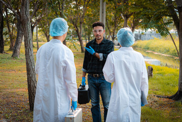 Scientists team collect water samples for analysis and research on water quality, environment with...