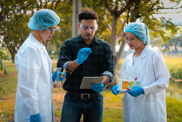Scientists team collect water samples for analysis and research on water quality, environment with...