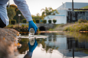 Scientists team collect water samples for analysis and research on water quality, environment with saving earth.
