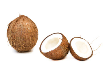 Two coconut one of which split isolated on white background.