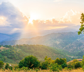 Fototapeta na wymiar Mountain valley during sunset or sunrise. Natural spring or summer season landscape