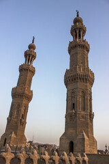 Fototapeta na wymiar Minarets of mosque of al-Mu'ayyad on top of Bab Zuwaila, Cairo, Egypt