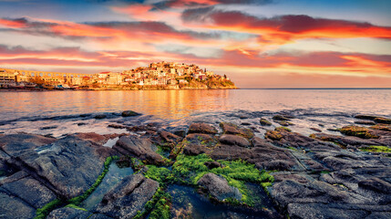 Exciting sunrise in Kavala city, Macedonia, Greece, Europe. Attractive summer seascape of Aegean...