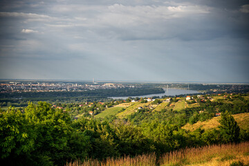 Beautiful summer landscape, green hills of Fruska Gora, travel to Serbia. Panoramic view of Novi Sad and the Danube river