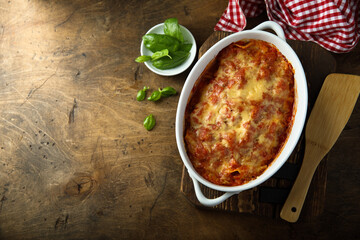 Traditional homemade lasagna with fresh basil