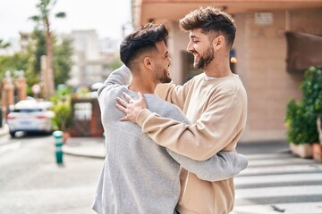 Obraz premium Young couple smiling confident dancing at street