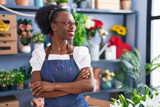 African american woman florist smiling confident standing with arms crossed gesture at florist store