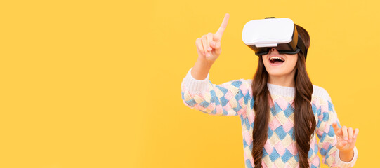 using VR headset. kid play video game. Digital future and innovation. child in virtual goggles. Banner of child girl with virtual reality vr headset, studio portrait with copy space.