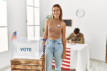 Young american voter woman standing by ballot box at electoral college.