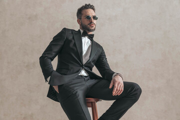 bearded young groom with hand in pocket posing and being confident