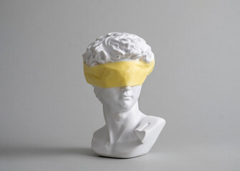 Michelangelo's David head bust in duct tape sealed mouth. Minimal concept on gray background censorship of freedom of speech and restrictions of thought and word. Fight for your rights. © sergign