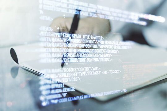 Multi exposure of abstract creative coding sketch and man hand writing in notebook on background, artificial intelligence and neural networks concept