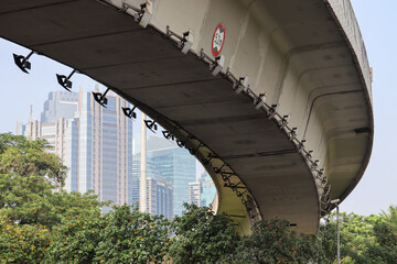 Obraz premium selective focus frog view of construction of curved overpass at Semanggi intersection jakarta