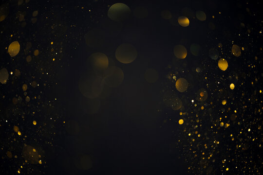 Dreamy golden swirly bokeh glitter lights overlay on dark background
