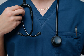 Medical stethoscope. Black medical stethoscope.A doctor with a stethoscope.A doctor holding a...
