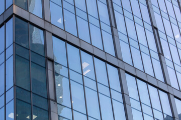 Fototapeta na wymiar Glass walls of a skyscraper as a background.