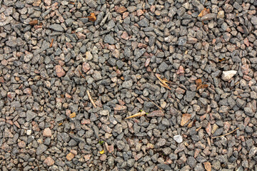 Small pebbles of crushed stone as an abstract background.