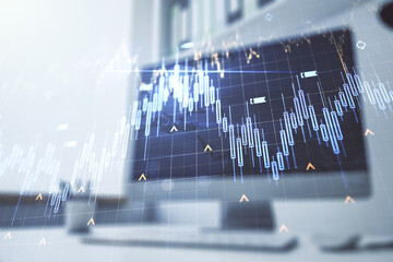 Double exposure of abstract creative financial diagram with world map and modern desk with computer on background, banking and accounting concept