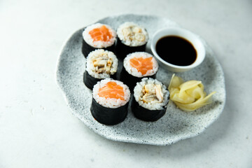 Healthy sushi rolls with salmon and eel