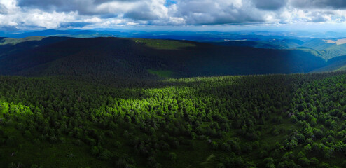Landscape with the shadows of the clouds on the mountains