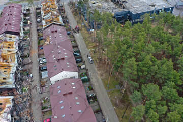 Top view of the destroyed and burnt houses. Houses were destroyed by rockets or mines from Russian soldiers. Cities of Ukraine after the Russian occupation.