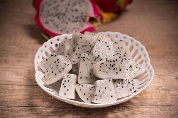 Sliced dragon fruit in a white plate