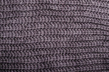 Black and gray knitted silk thread pattern for background.