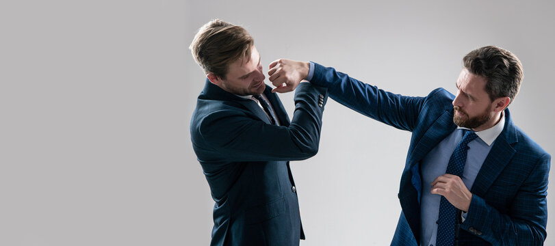 Man face portrait, banner with copy space. two angry businessmen punching in fight because of business competition, business knockout.
