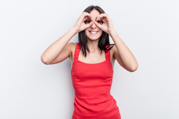 Obraz premium Young caucasian woman isolated on white background showing okay sign over eyes