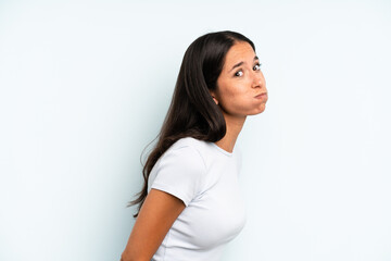 hispanic pretty woman with a goofy, crazy, surprised expression, puffing cheeks, feeling stuffed,...