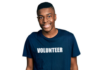 Young african american man wearing volunteer t shirt with a happy and cool smile on face. lucky person.