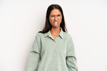 hispanic pretty woman feeling disgusted and irritated, sticking tongue out, disliking something...