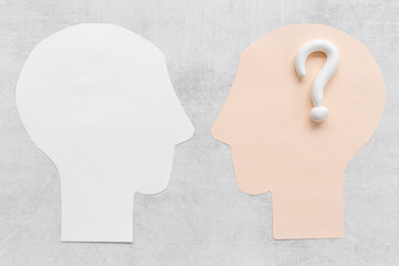 Question mark sign with paper human head. FAQ and help concept