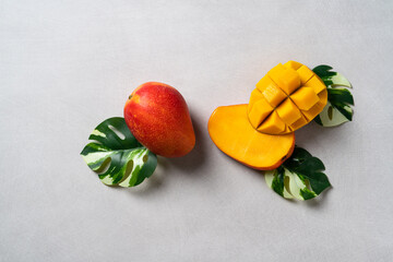 Mango background design concept. Top view Diced fresh mango fruit on gray table.