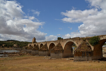 Obraz premium Ruins of the historic stone bridge of Puente Ajuda