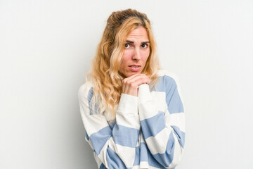 Young caucasian woman isolated on white background scared and afraid.