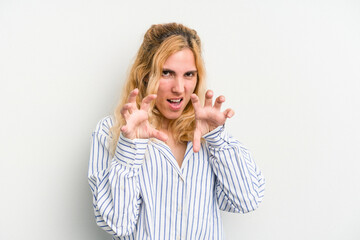 Young caucasian woman isolated on white background showing claws imitating a cat, aggressive gesture.
