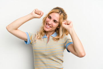 Young caucasian woman isolated on white background celebrating a special day, jumps and raise arms with energy.